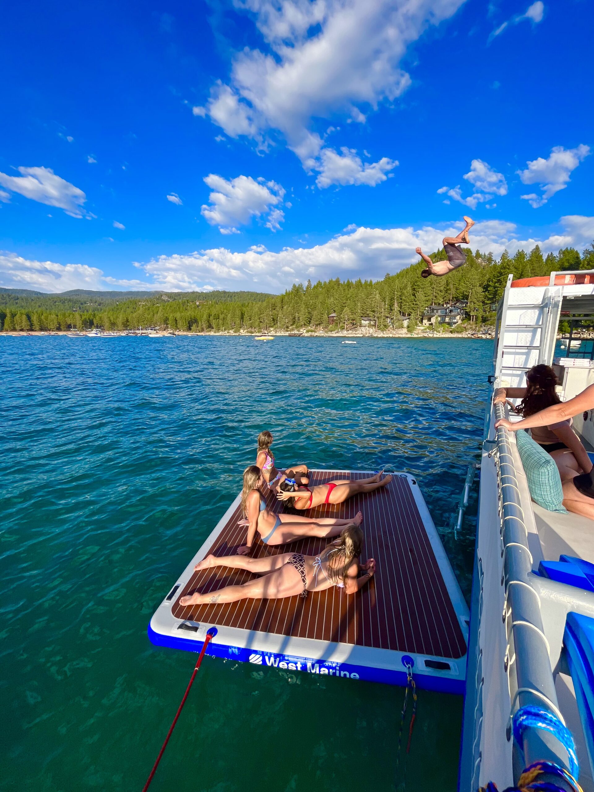 Lake Tahoe Party Boat with floating mat for swimming
