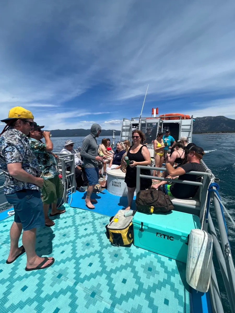 Group of people relaxing on Lake Tahoe party boat rental by Lake Tahoe Boat Rides