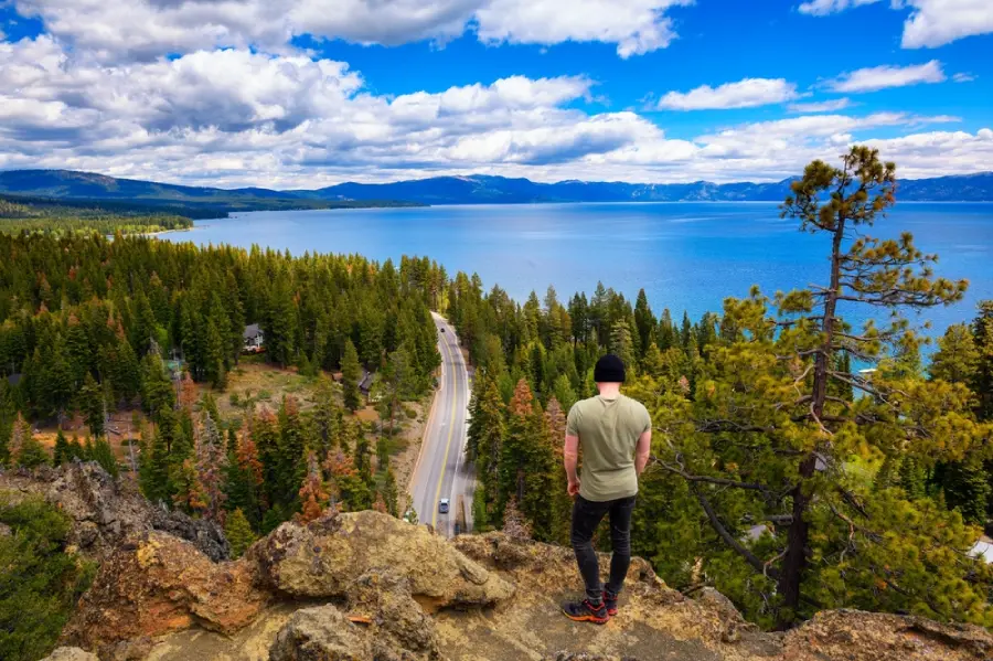 A hiker at Eagle Rock overlooking Lake Tahoe.