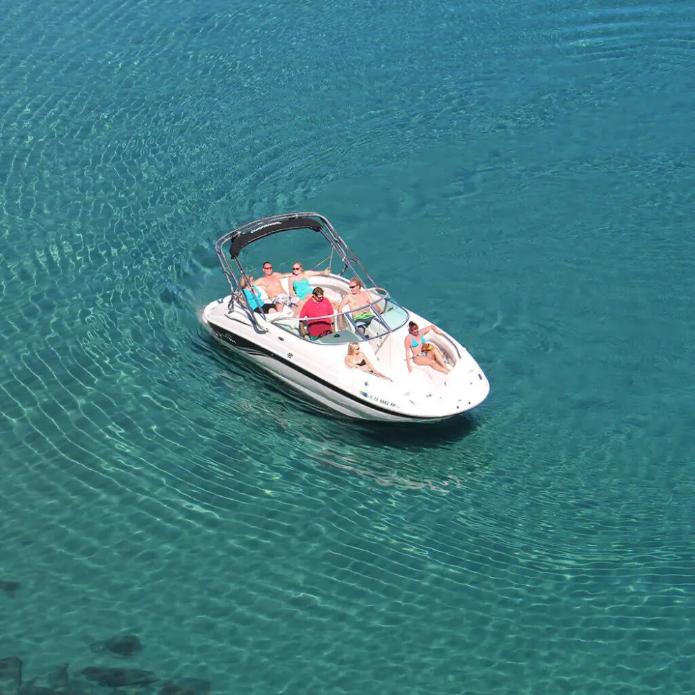 People relaxing on Lake Tahoe boat tour by Lake Tahoe Boat Rides